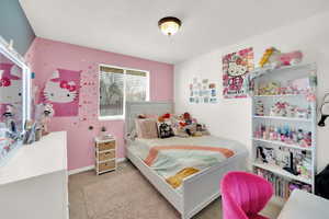 Bedroom with carpet and baseboards