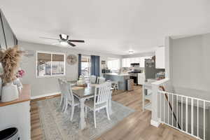 Dining space with baseboards, light wood-type flooring, and ceiling fan