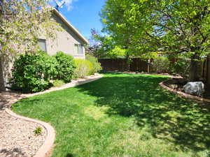View of yard featuring a fenced backyard