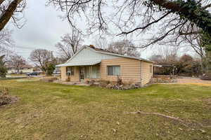 View of front of property with a front yard