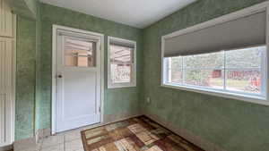 Unfurnished room featuring baseboards