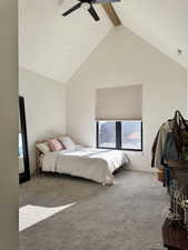 Bedroom featuring high vaulted ceiling, beam ceiling, carpet floors, and ceiling fan
