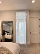 Primary bedroom hallway to closets and bathroom