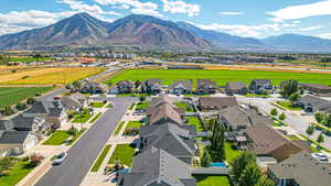 Birds eye view of property with a residential view and a mountain view