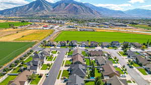 Birds eye view of property featuring a mountain view and a residential view