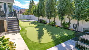 View of yard with a mountain view and a fenced backyard