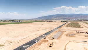 Overview of rural landscape featuring a mountain backdrop