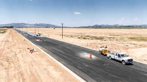 View of asphalt street with a mountain view and a view of countryside