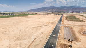 Aerial view of sparsely populated area featuring a mountain backdrop