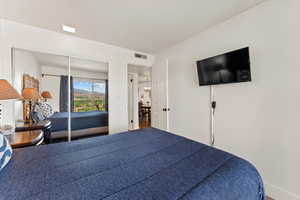 Bedroom featuring visible vents and baseboards