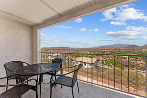Balcony featuring a mountain view and a residential view