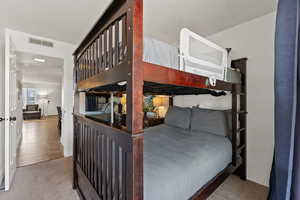Bedroom featuring visible vents and carpet