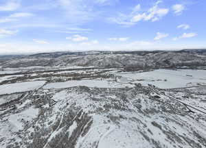 Snowy aerial view with a mountain view