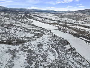 Snowy aerial view with a mountain view