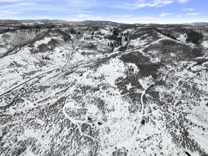 Snowy aerial view with a mountain view