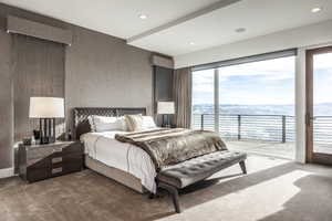 Carpeted bedroom with access to outside, a water view, and recessed lighting