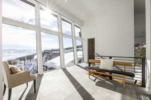 Common area featuring high vaulted ceiling and a mountain view