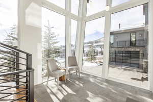 Sunroom featuring healthy amount of natural light
