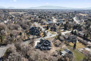 Birds eye view of property with a residential view and a mountain view