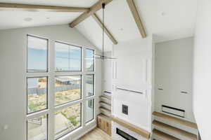 Interior space with beam ceiling and wood finished floors