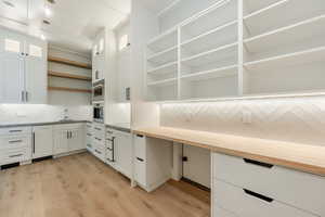 Pantry featuring a sink