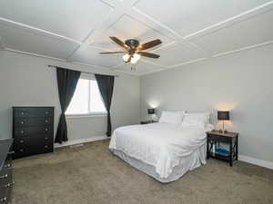 Bedroom with baseboards, carpet flooring, and coffered ceiling