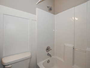 Full bath featuring shower / bathing tub combination and toilet