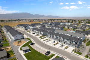 Birds eye view of property with a mountain view and a residential view