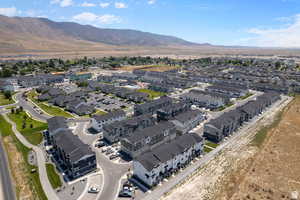 Birds eye view of property with a residential view and a mountain view