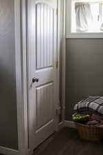 Mudroom with dark carpet