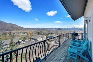 Balcony featuring a grill and a mountain view