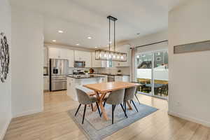 Dining space with recessed lighting, baseboards, and light wood-type flooring