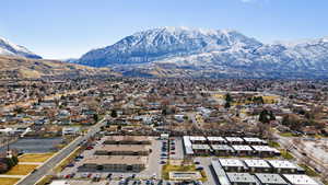 Birds eye view of property with a residential view and a mountain view