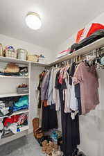 Master Walk in closet with carpet floors