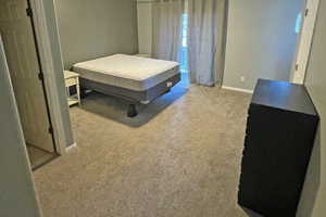 Upstairs Primary bedroom with ensuite bath, and carpet