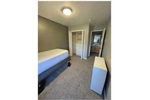 Upstairs private bedroom #3 featuring a closet, a carpet and baseboards