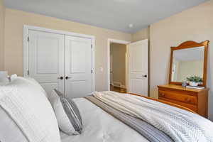 Guest Bedroom with a closet and visible vents
