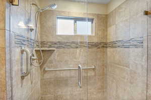Primary Suite featuring a shower stall