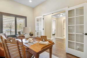 Office space featuring recessed lighting, crown molding, baseboards, and wood finished floors