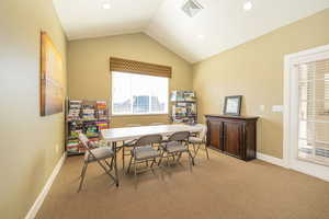 Dining area with visible vents, baseboards, recessed lighting, lofted ceiling, and light colored carpet
