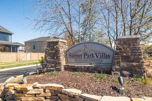 Community sign featuring fence
