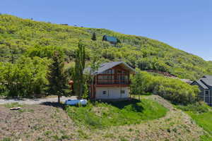 View from above of property with a heavily wooded area