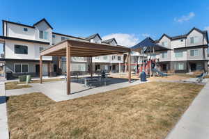Exterior space with a yard, playground community, and a residential view
