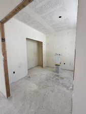 Unfurnished room with a textured ceiling