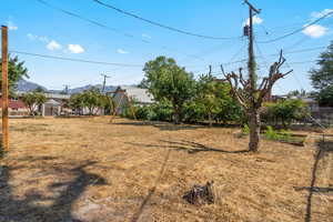 View of yard featuring fence