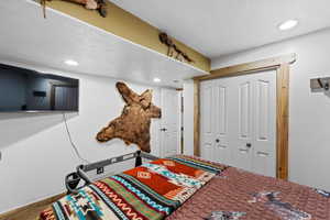 Bedroom with a closet and recessed lighting