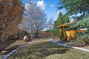 View of yard with fence