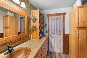 Master Bathroom featuring wood finished floors and vanity