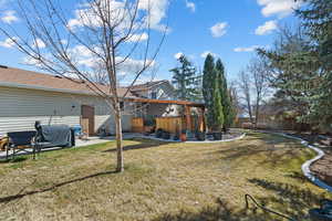 View of yard with a patio, a jacuzzi, and fence private yard