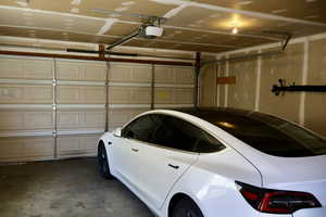 Garage featuring a garage door opener